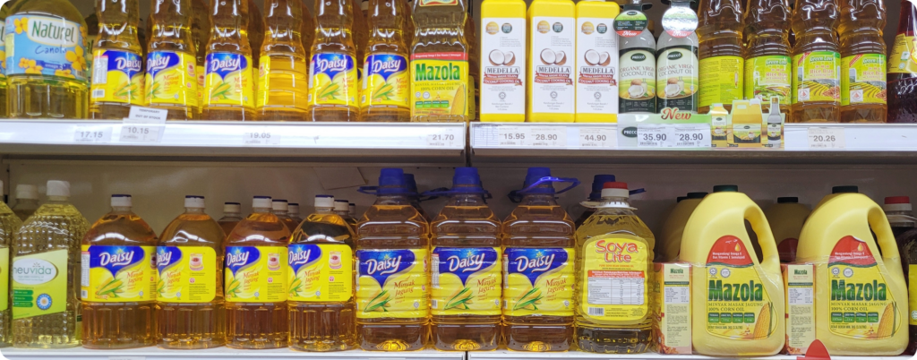 Bottles of canola oil on the shelf of a grocery store 