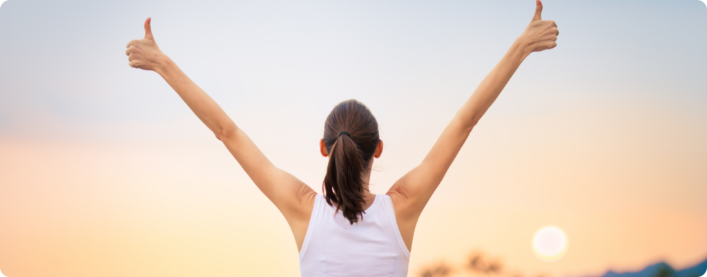 A woman feeling energized and accomplished after a run