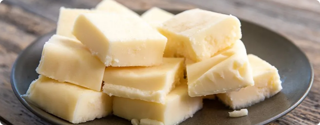 A spread of butter on the table 