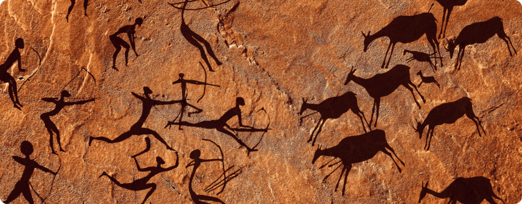 A cave painting of people hunting 