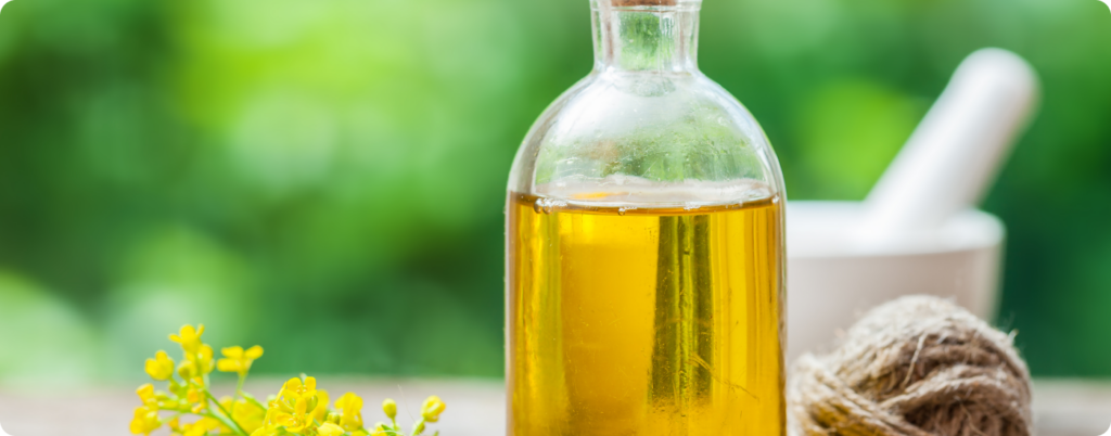 A bottle of canola oil outside